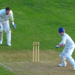 two players are playing cricket in the ground