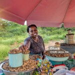 lady keeping her hand on the food bucket