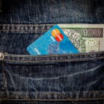 credit cards with money in pocket