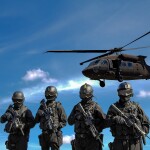 Soldiers in front of a helicopter